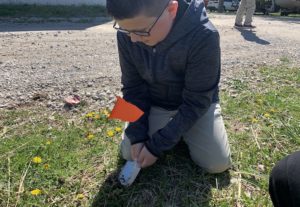 Multi-Age Student Planting Pumpkin Seeds