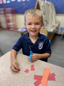 Student Cutting Paper