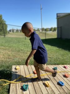 Early Childhood Student Playing Outdoors