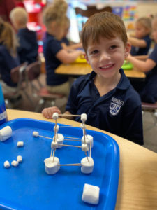 Student Building a Marshmallow Tower